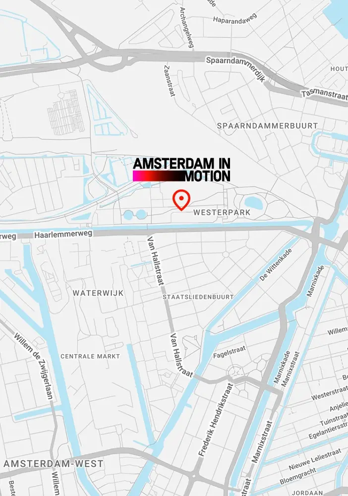 Detailed map of Amsterdam with 'Amsterdam in Motion' logo, showing Westerpark and surrounding neighborhoods and canals